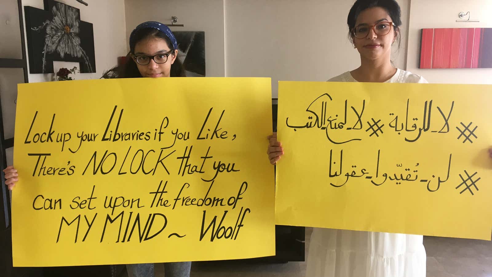 Fatima Matar (right) and her daughter, Jori, created signs to protest the Kuwaiti government&#39;s book ban. Matar&#39;s sign reads &quot;No to censorship and book banning.&quot; (September, 2018)